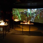 mellifera_extensions : mellifera installed in a more intimate gallery setting with a curved projection screen